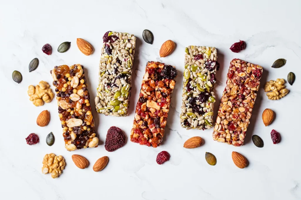 Energy granola bars with different seeds, nuts and dried fruits and berries