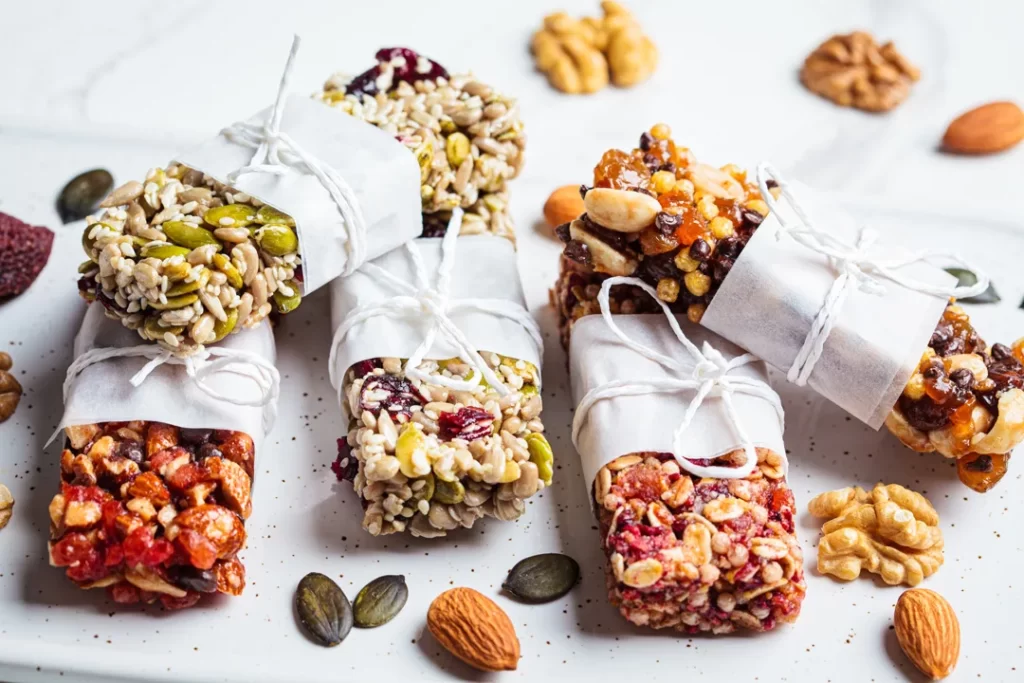 Energy granola bars with different seeds, nuts and dried fruits and berries