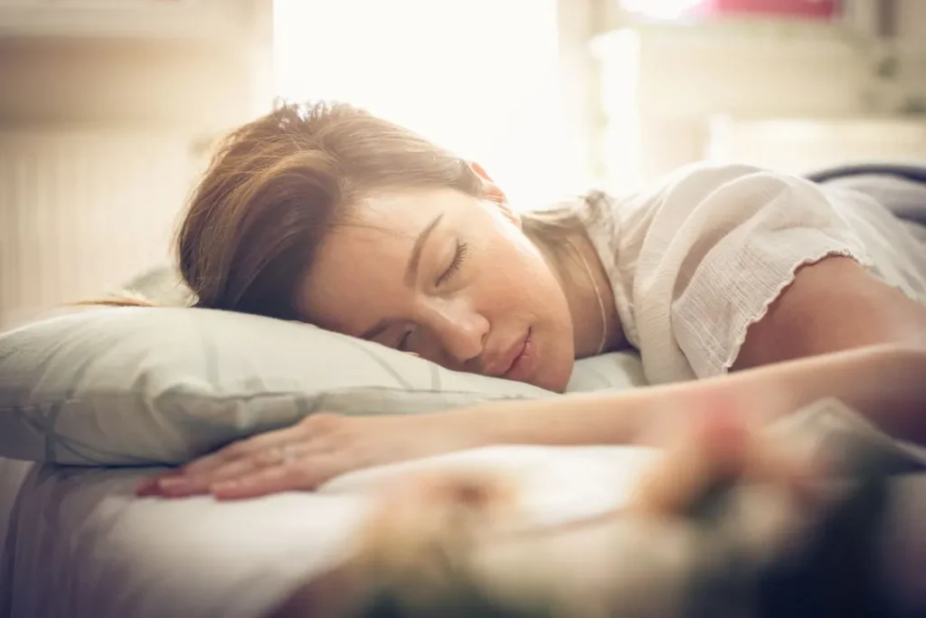 women sleep on a bed