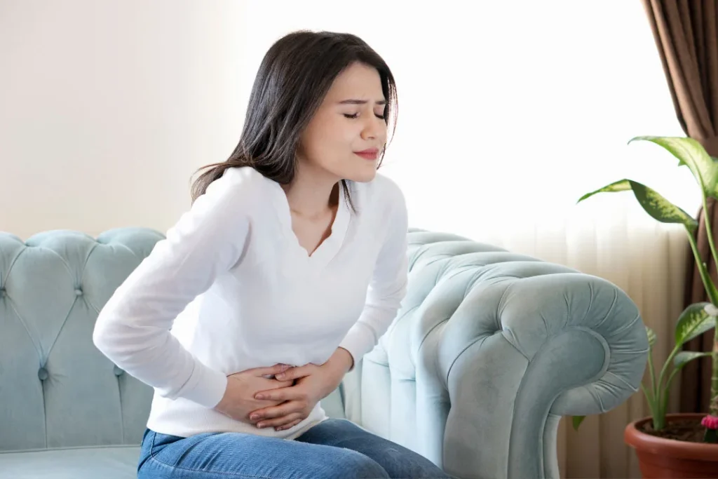 A girl having stomach pain.