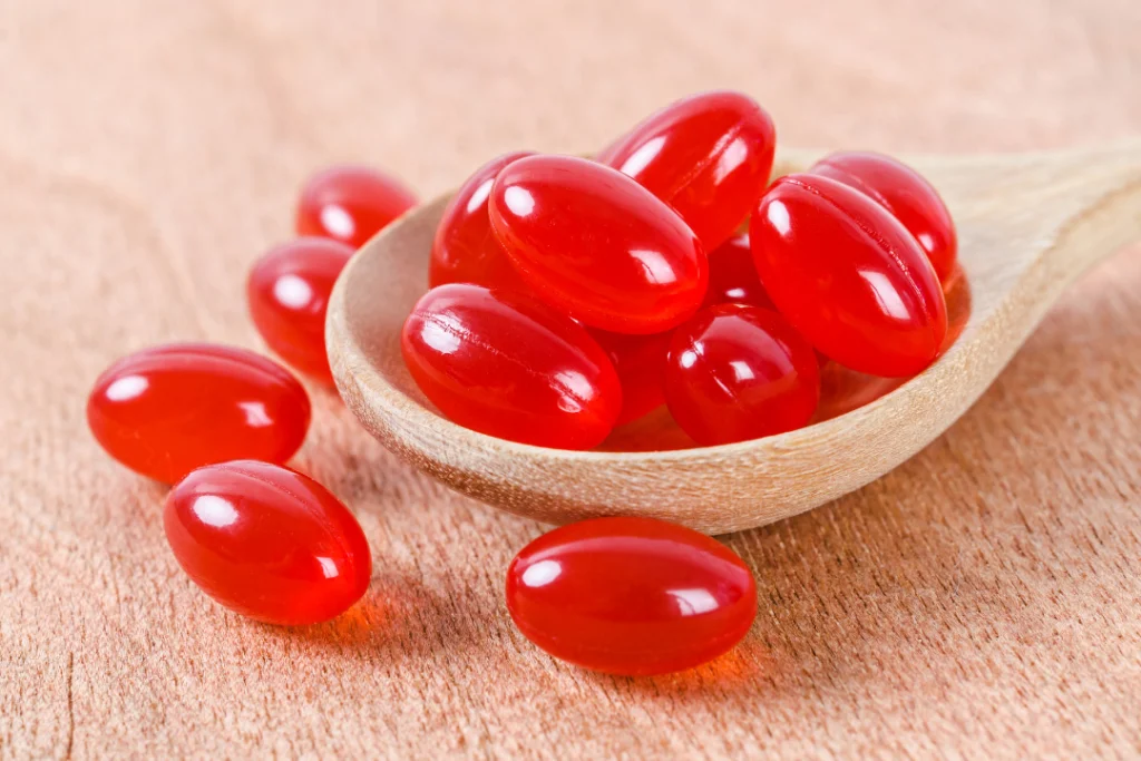 Timeless Coenzyme Q10 pills in a wooden spoon