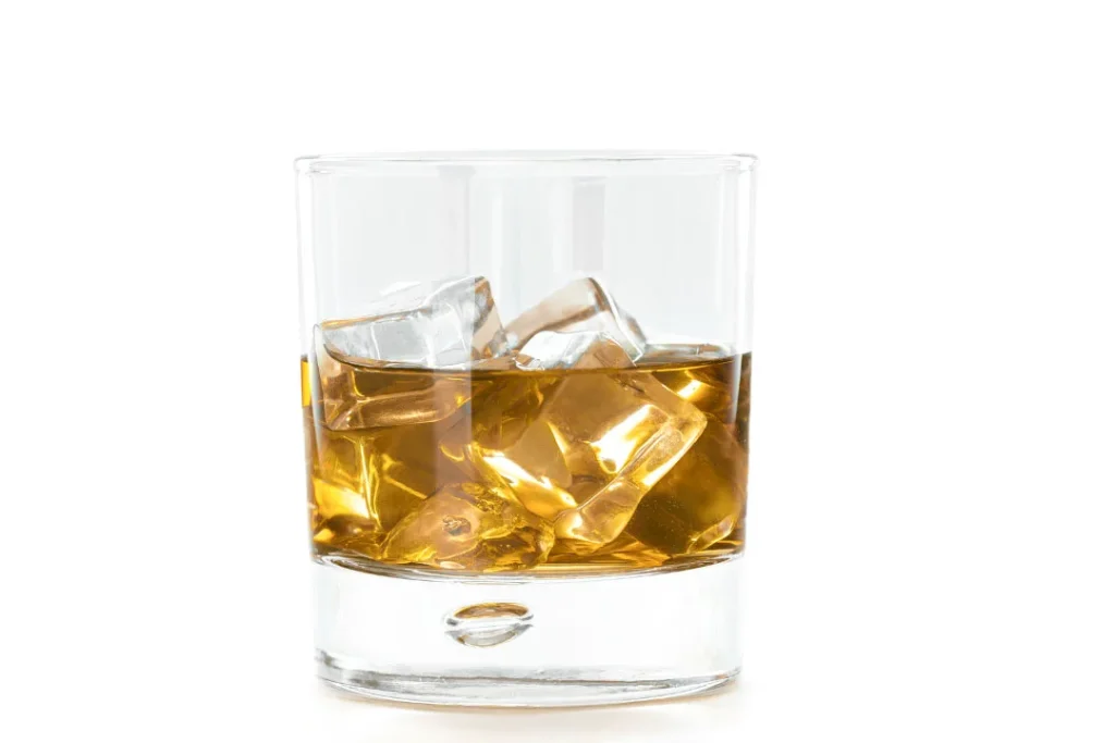 A glass of alcohol.