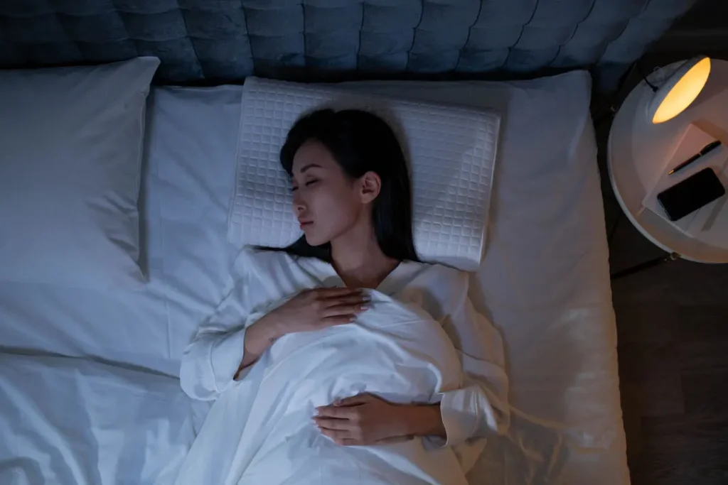 woman sleeping on a bed.
supplements for sleep apnea