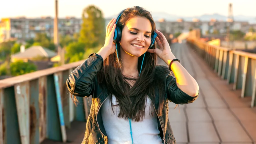 Lady is listening music.