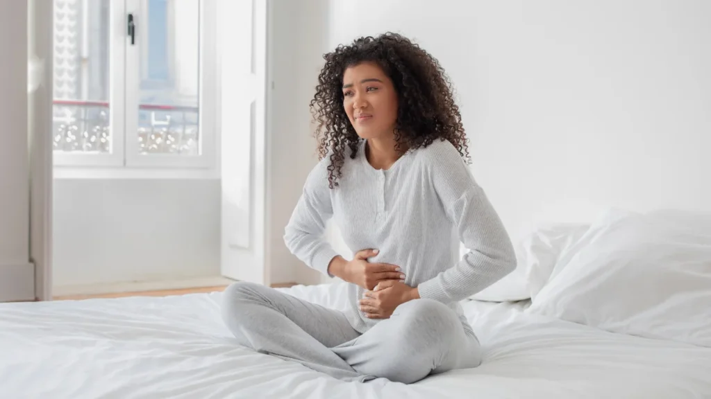 Lady having belly pain.