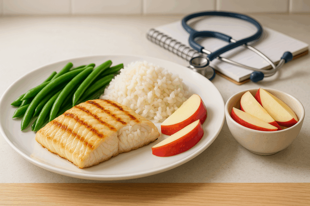 Grilled white fish with rice, green beans, and apple slices on a kitchen counter as part of a 7 day meal plan for kidney disease.